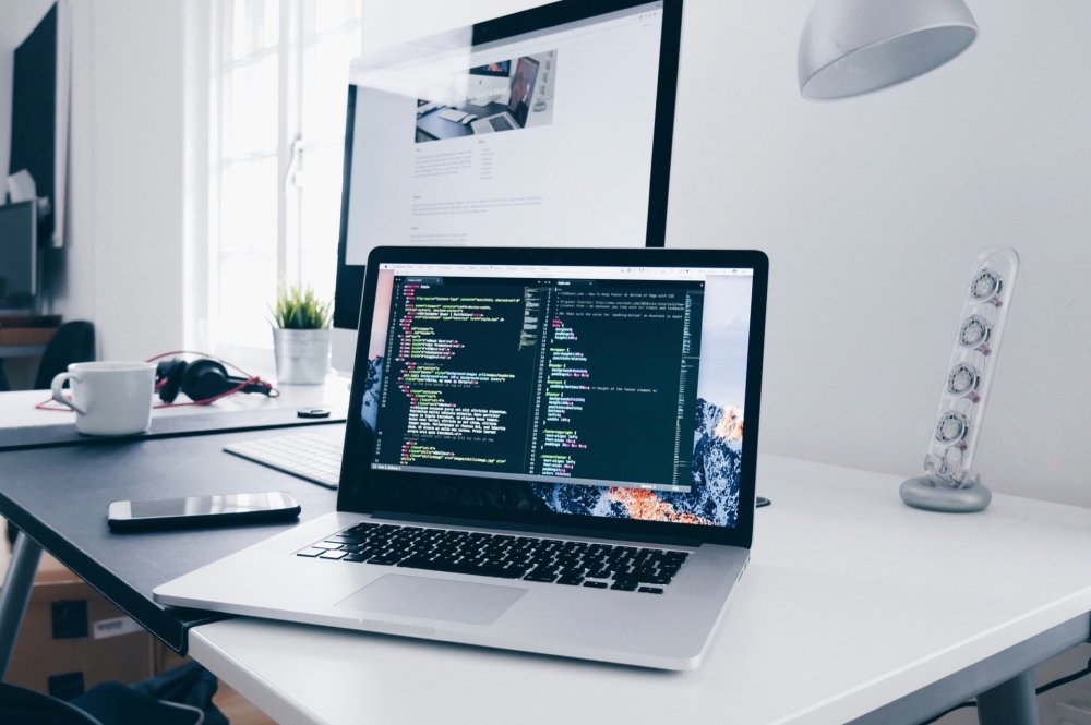 Laptop and monitor on a desk
